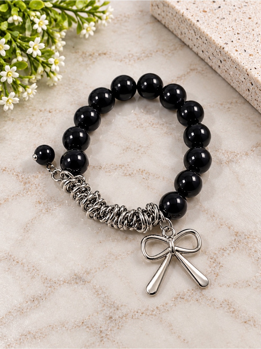 Black Beaded Bracelet with Silver Bow Charm